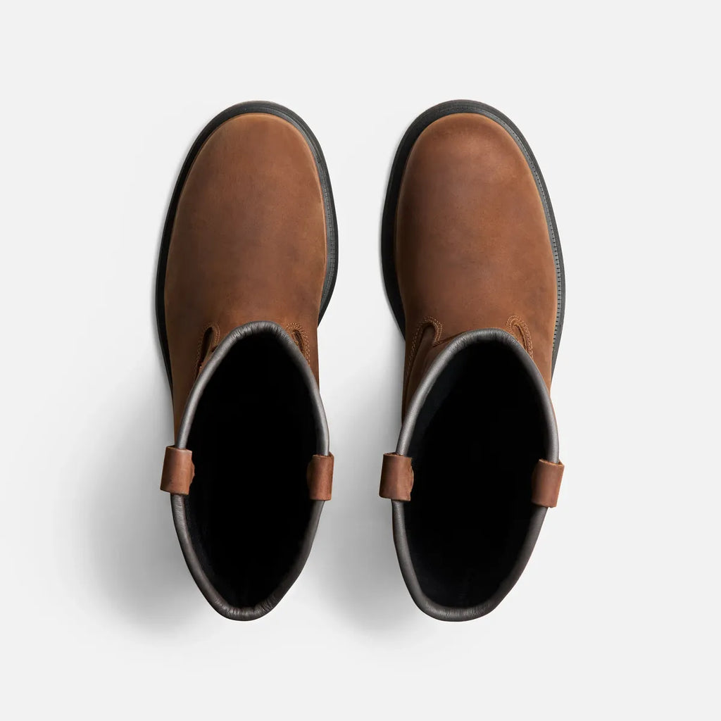 Top-down view of a pair of brown pull-on work boots with leather pull tabs