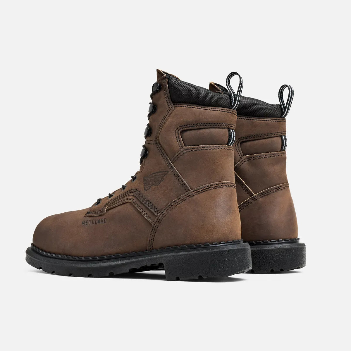 Red Wing steel toe metguard work boots shown from rear angle displaying heel and ankle collar detail