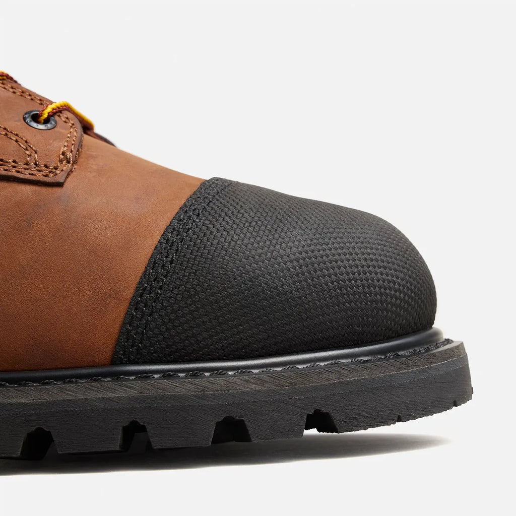 Close-up detail of steel toe cap and rugged lug sole on a work boot