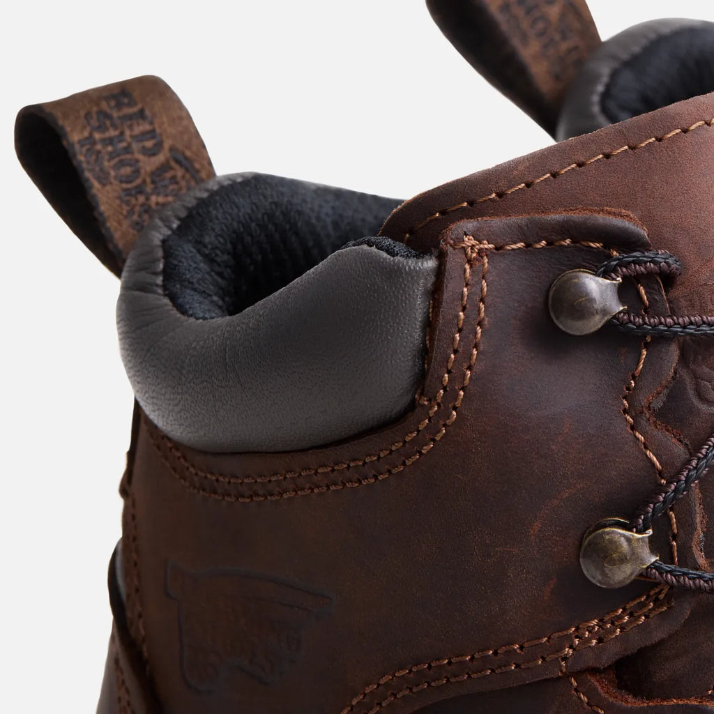 Close-up detail of Red Wing leather boot heel collar, laces, and pull tab