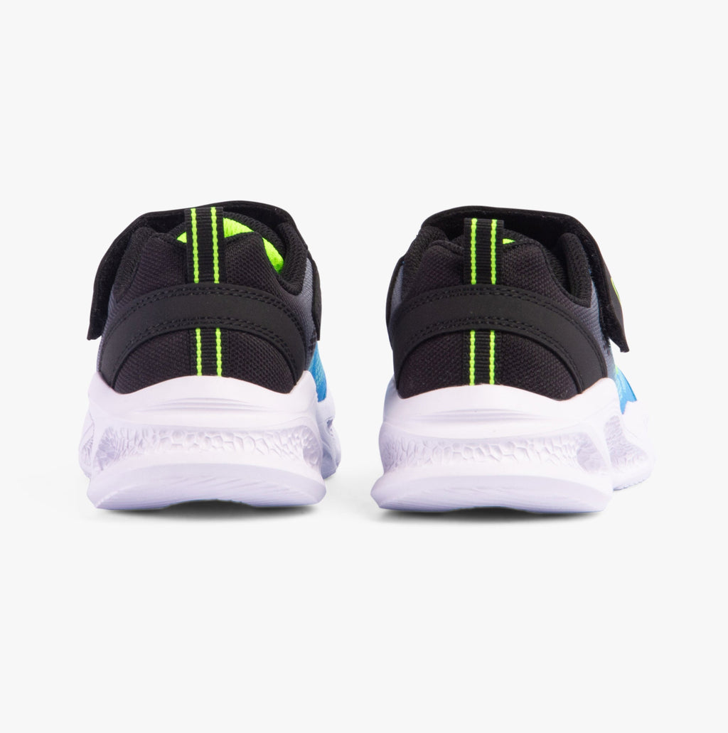 Rear view of boys black athletic sneakers with velcro strap and white sole