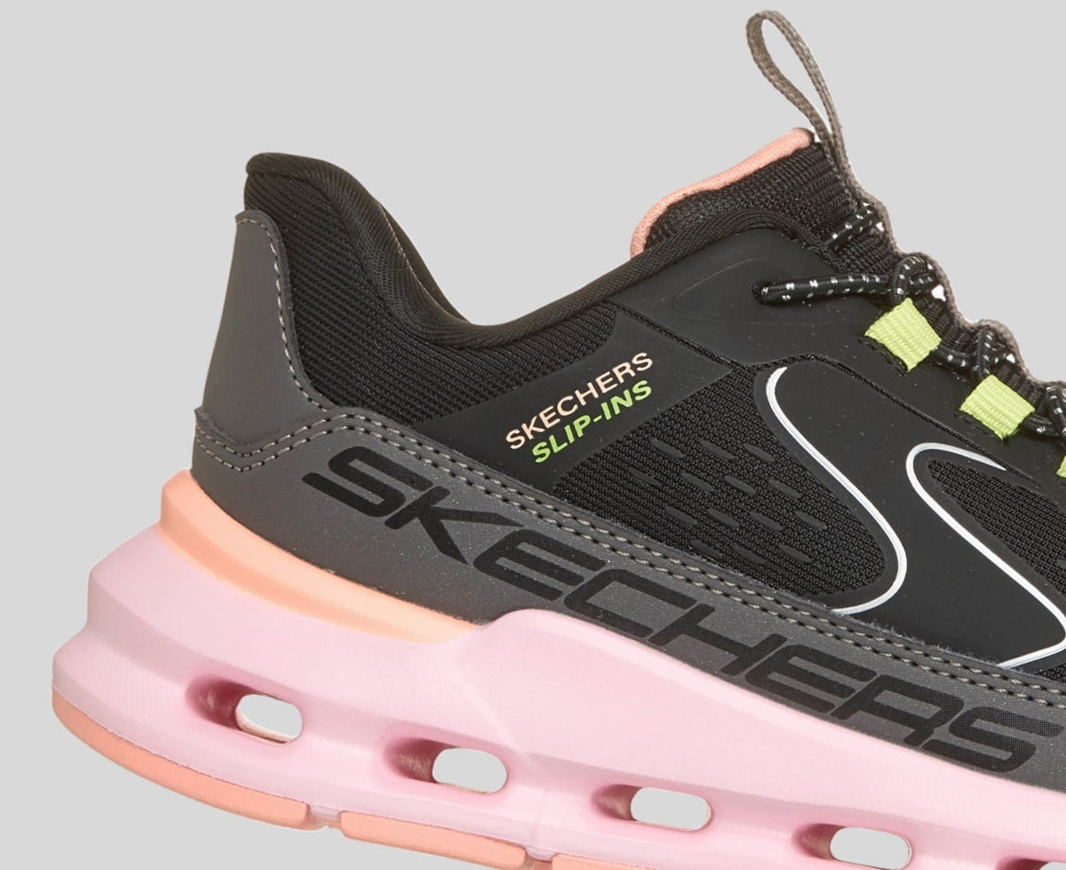 Close-up detail of Skechers Slip-Ins girls sneaker showing heel tab and cushioned midsole