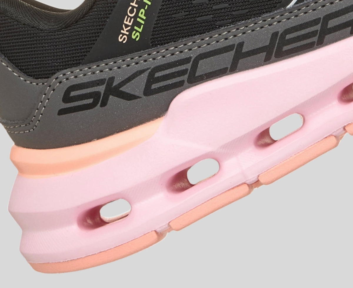 Close-up detail of Skechers Slip-In sneaker heel with pink cushioned sole and ventilation cutouts