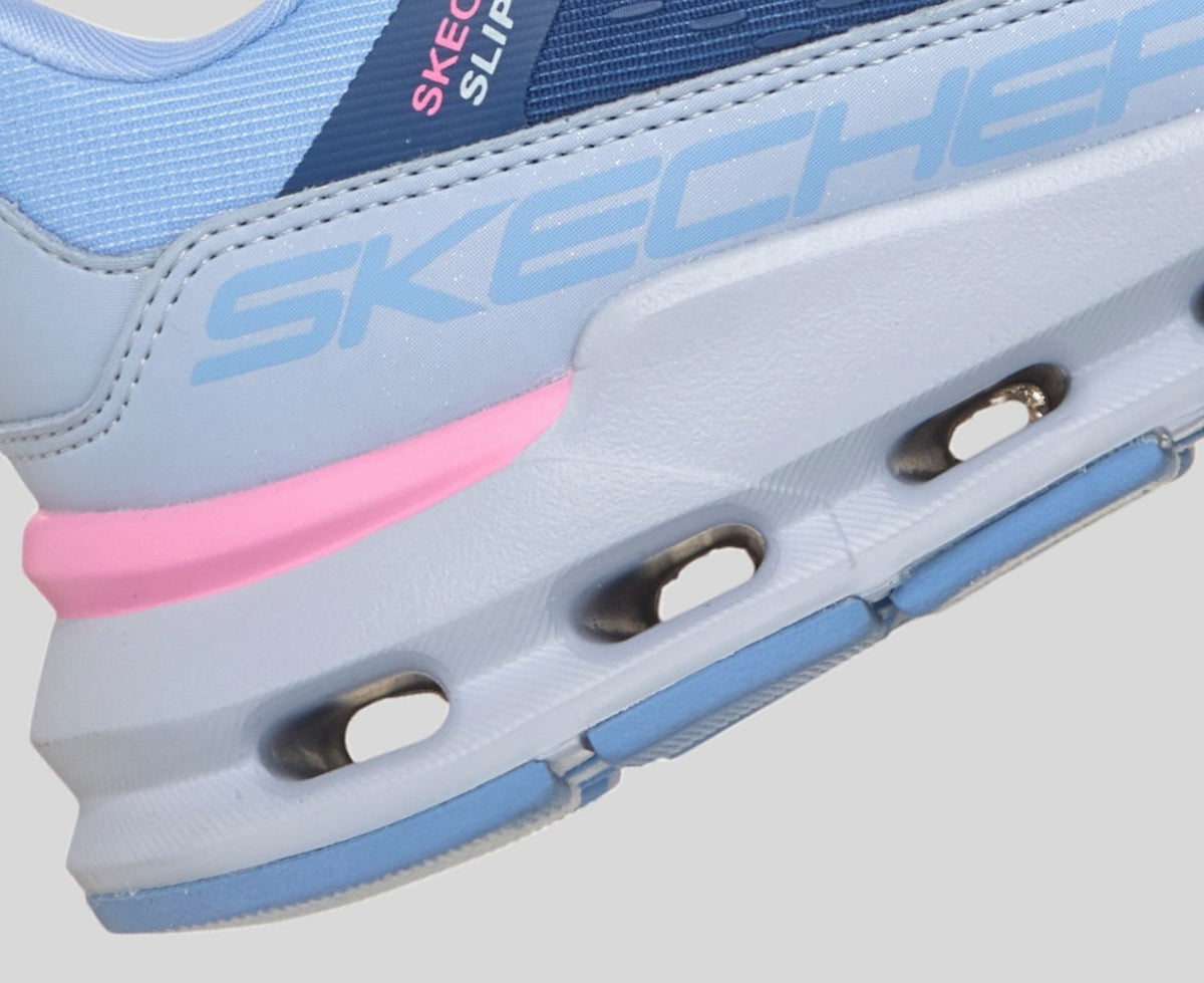 Close-up detail of Skechers girls slip-in sneaker midsole with pink accent and Skechers branding