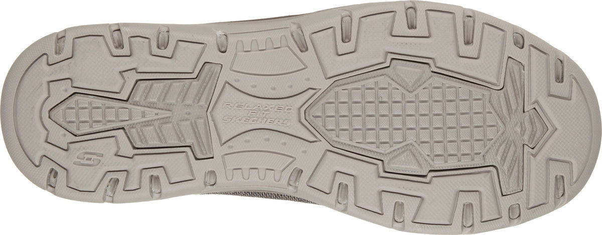 Bottom sole view of Skechers Relaxed Fit shoe showing tread pattern and brand logo