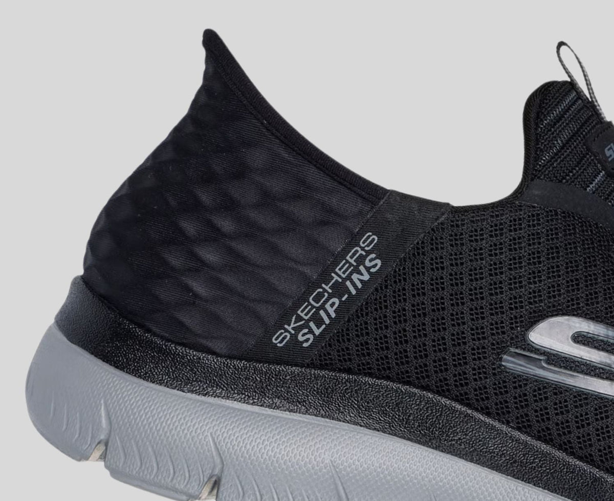 Close-up detail of Skechers Slip-Ins sneaker heel showing mesh upper and Slip-Ins branding