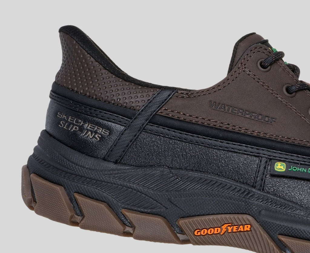 Close-up detail of Skechers John Deere waterproof slip-ins shoe heel and Goodyear outsole