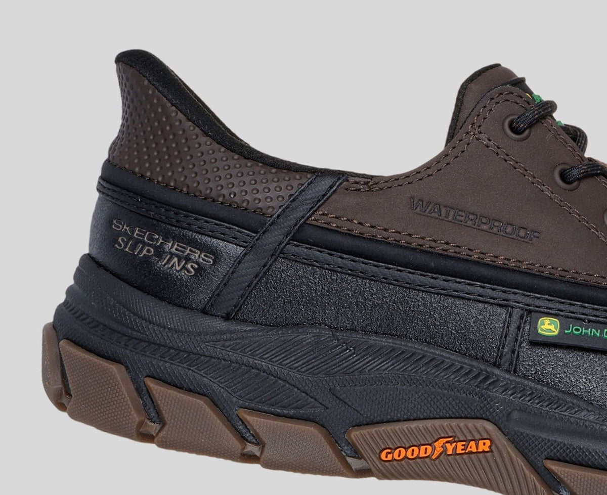 Close-up detail of Skechers John Deere waterproof slip-ins shoe heel and Goodyear outsole