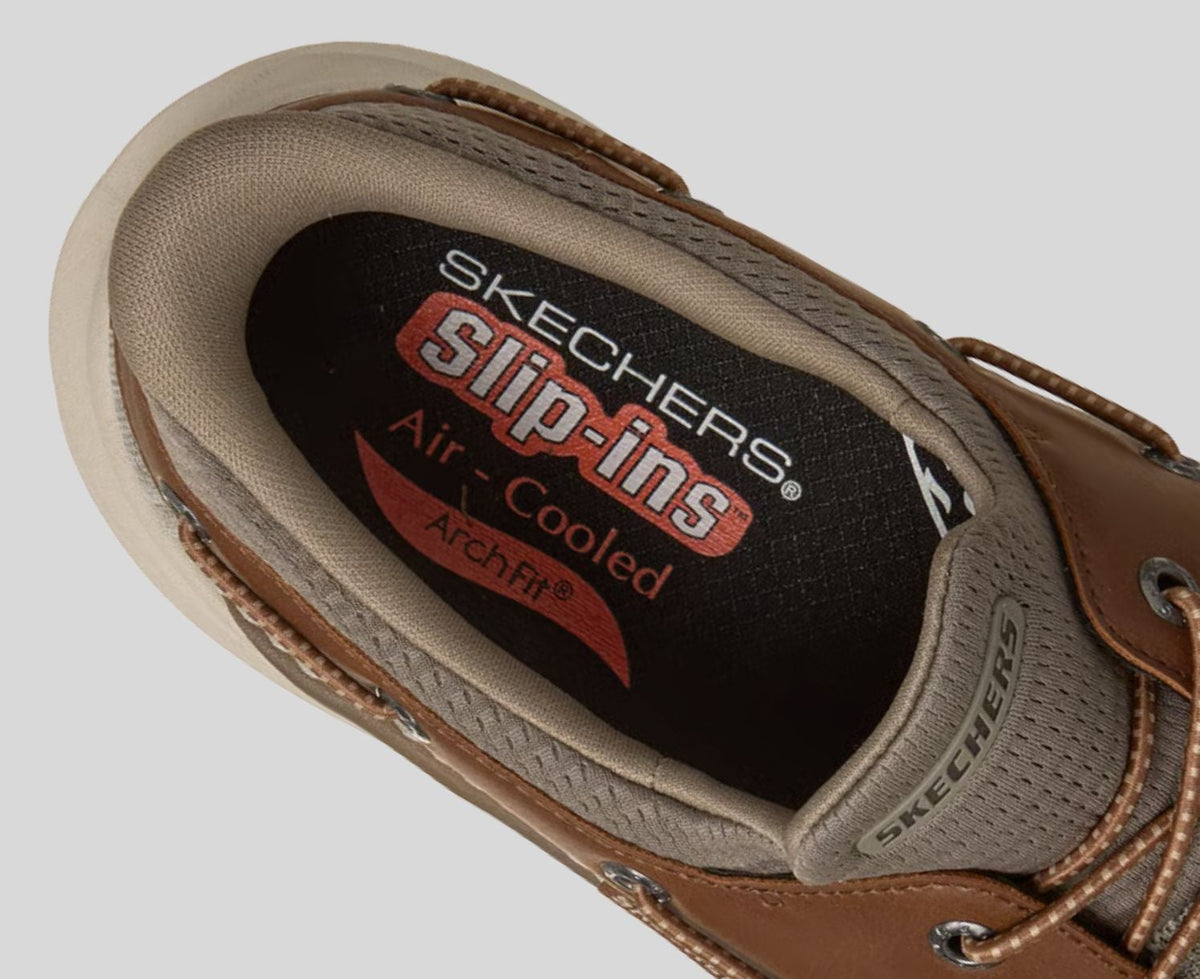 Close-up detail of Skechers Slip-ins Arch Fit insole inside a taupe brown boat shoe