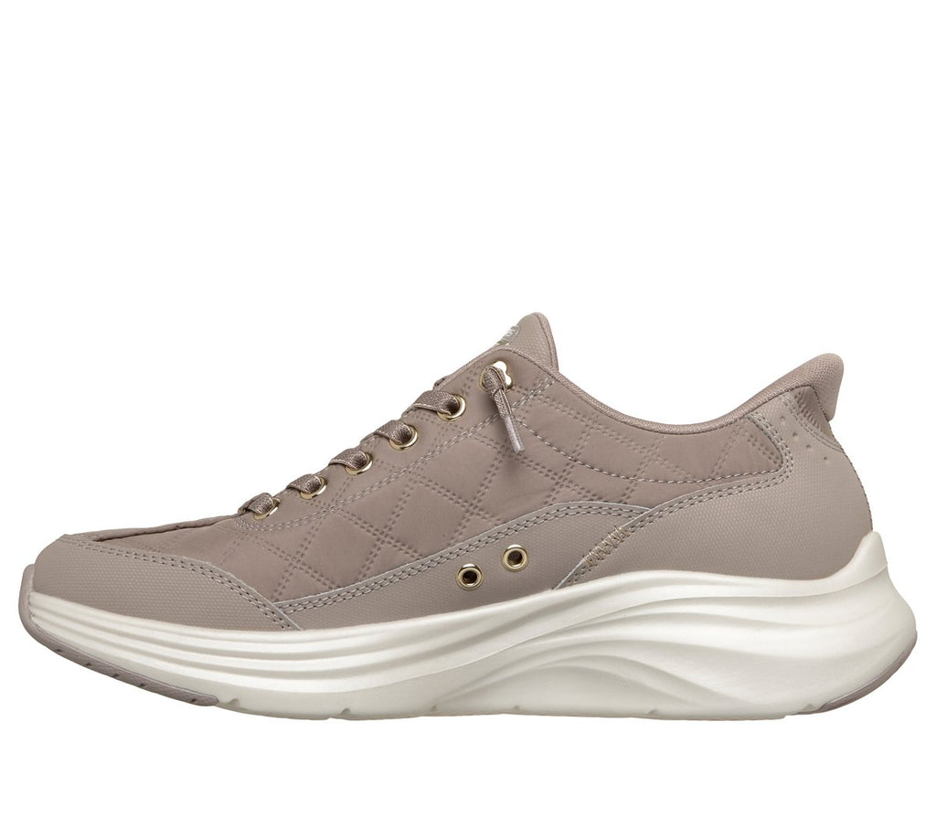 Skechers women's slip-in sneaker with quilted upper, gold eyelets, and chunky white sole