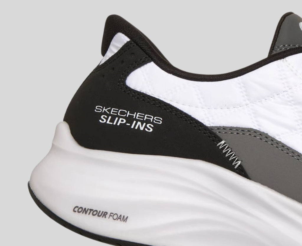 Close-up detail of Skechers Slip-ins heel with Contour Foam midsole branding visible