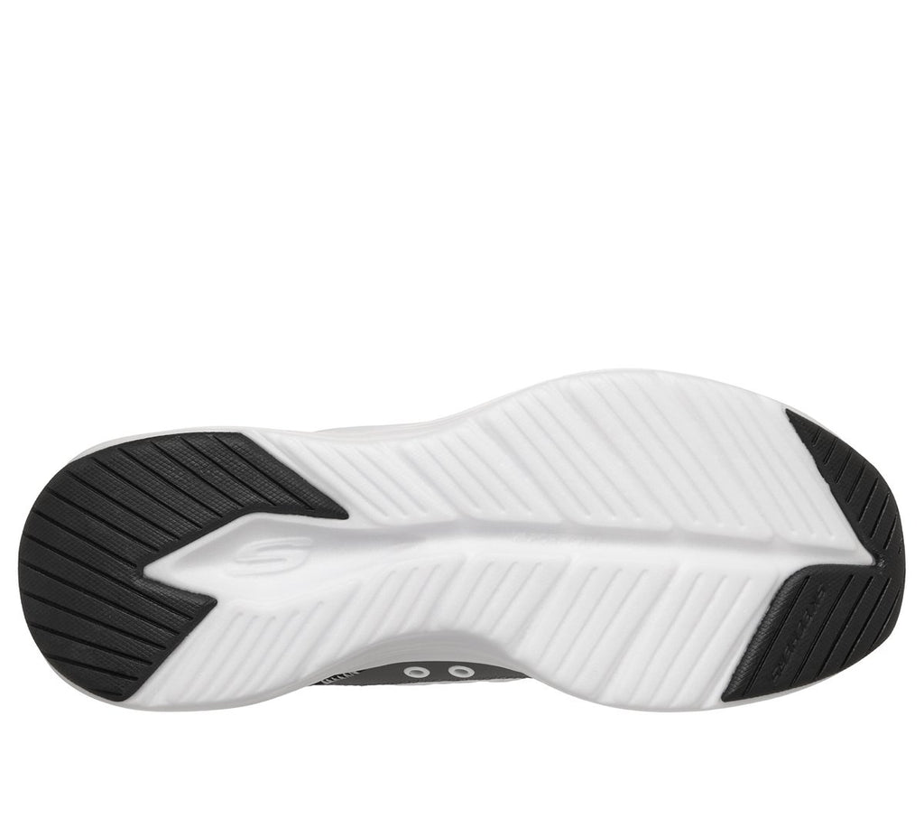 Bottom sole view of Skechers slip-in sneaker showing white midsole and black rubber outsole tread