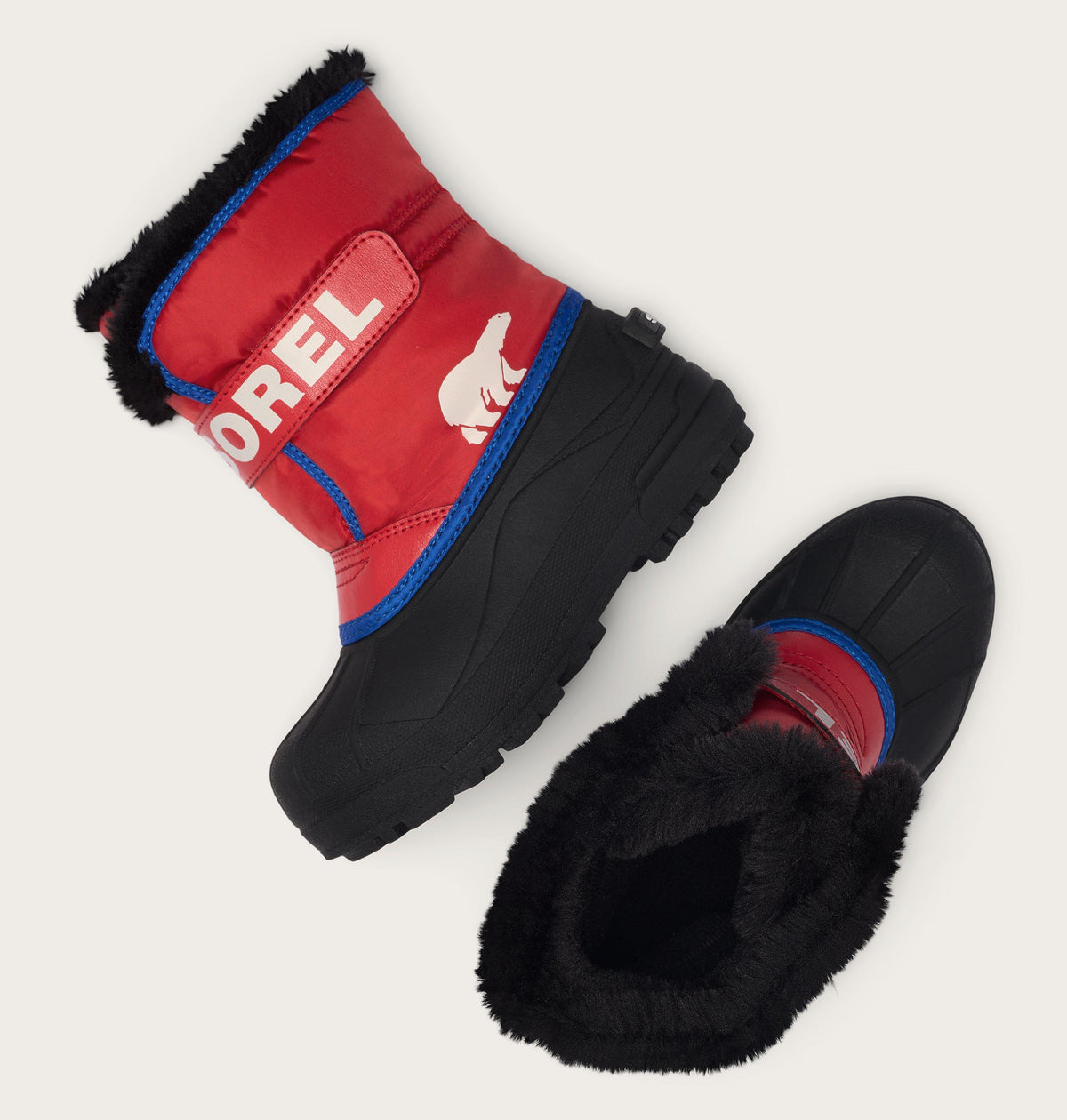 Kids Sorel Snow Commander winter boots with fur lining, shown as a pair from angled view
