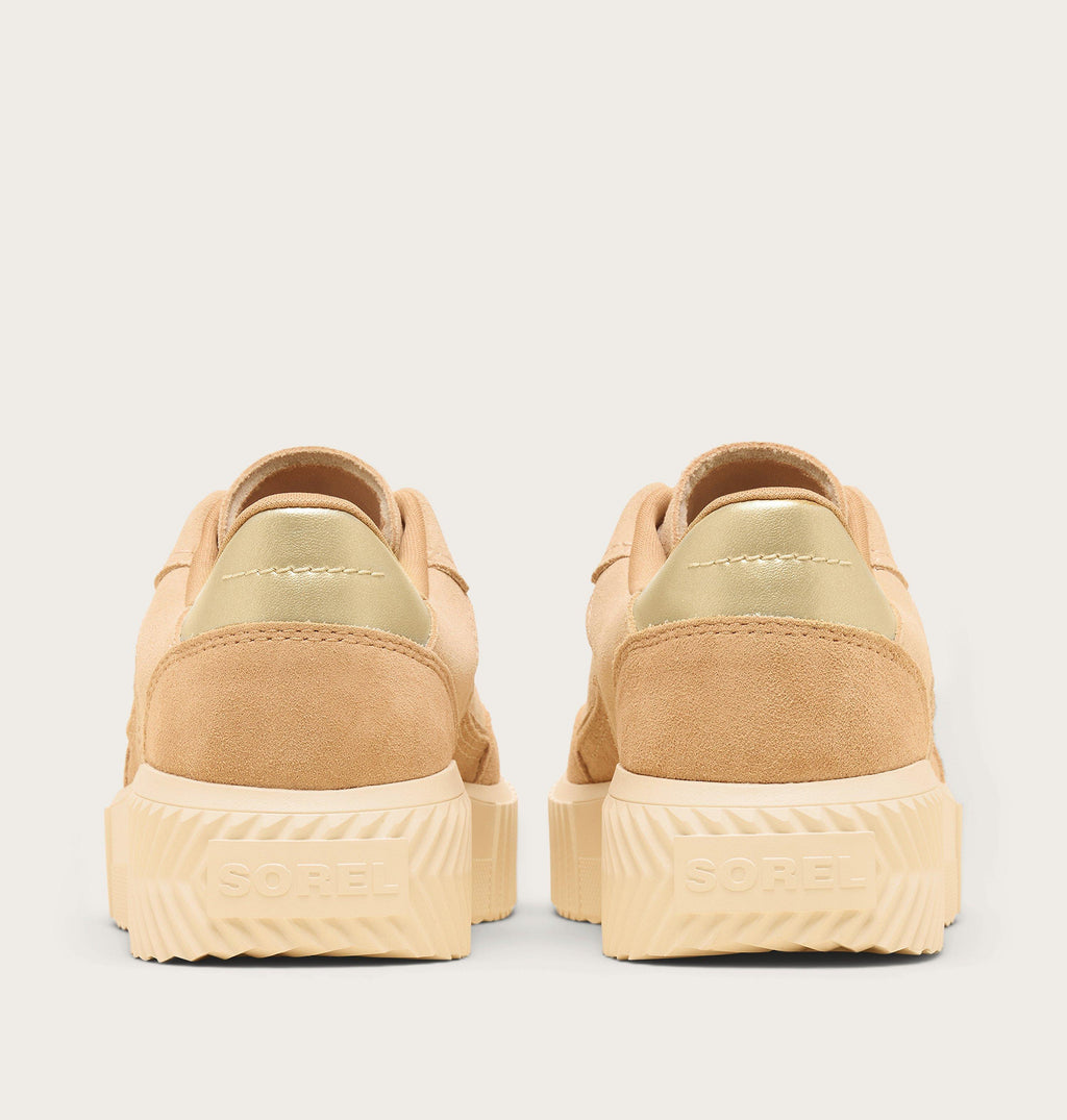 Rear view of Sorel women's low-top suede sneakers with gold metallic heel detail