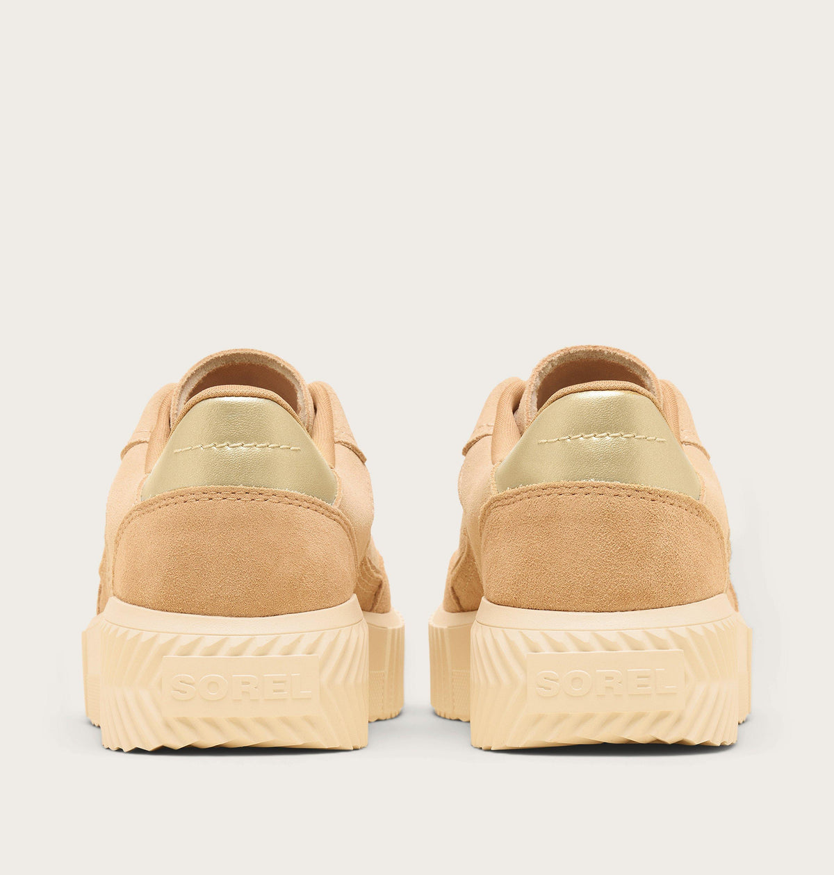 Rear view of Sorel women's low-top suede sneakers with gold metallic heel detail