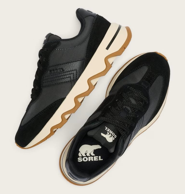 Sorel Kinetic Ember sneakers in black with zigzag gum sole, shown from side and top