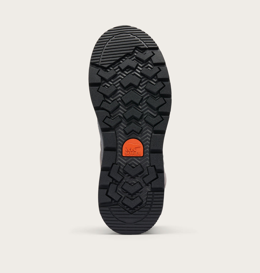 Bottom sole view of Sorel winter boot showing aggressive black rubber tread pattern