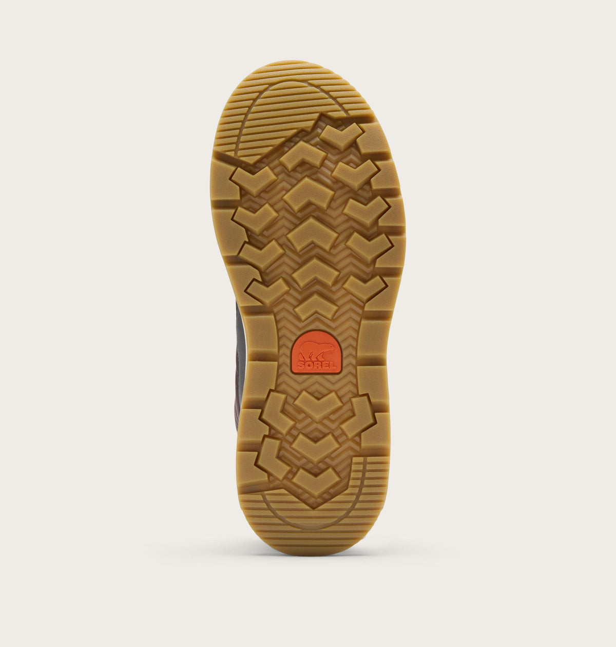 Bottom view of Sorel boot showing gum rubber chevron tread pattern with orange logo medallion