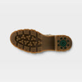 Bottom sole view of a chunky lug-sole boot with treaded grip pattern and green heel detail