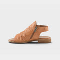Women's flat leather sandal with ruched toe vamp, side zipper closure, and slingback strap