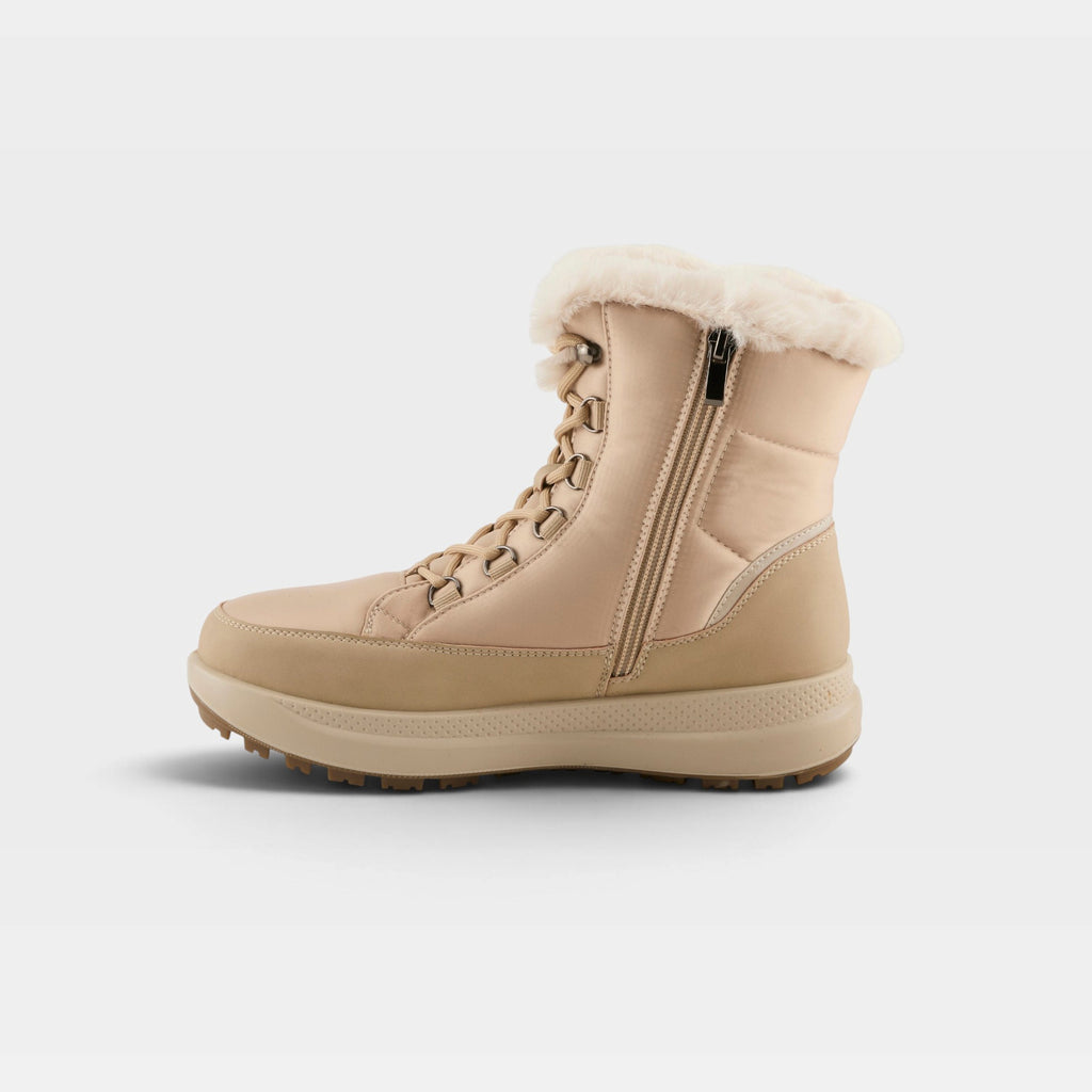 Women's winter boot with faux fur trim, side zipper, lace-up front, and chunky sole