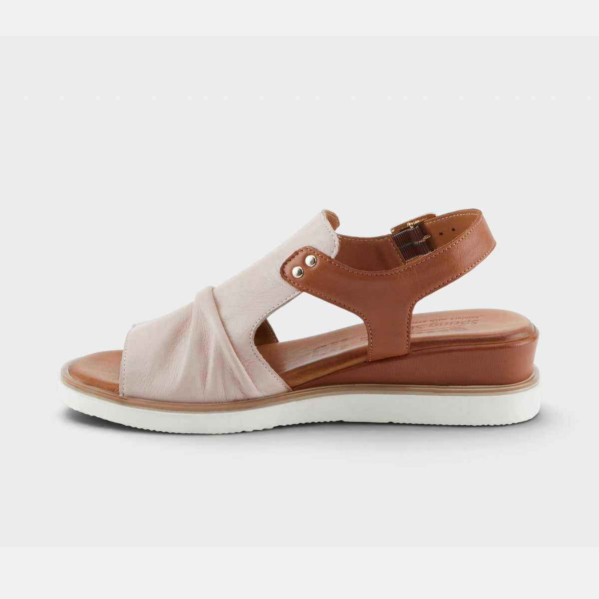 Women's leather sandal with ruched blush upper, tan slingback strap, and white sole