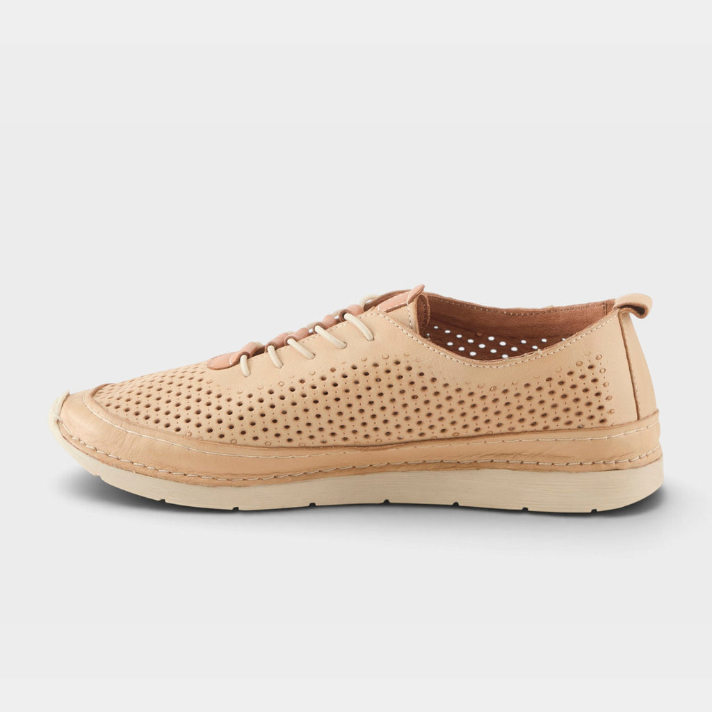 Side view of a perforated leather lace-up casual sneaker with a light cream sole