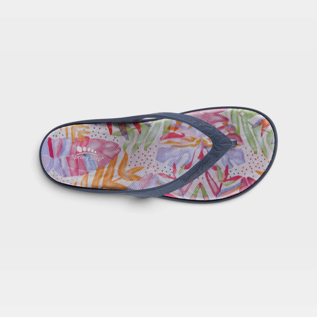 Spring Step flip flop sandal with colorful floral print footbed and navy strap, top view