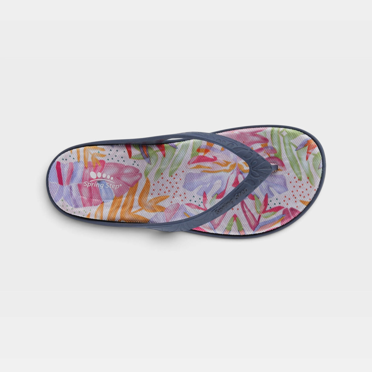Spring Step flip flop sandal with colorful floral print footbed and navy strap, top view