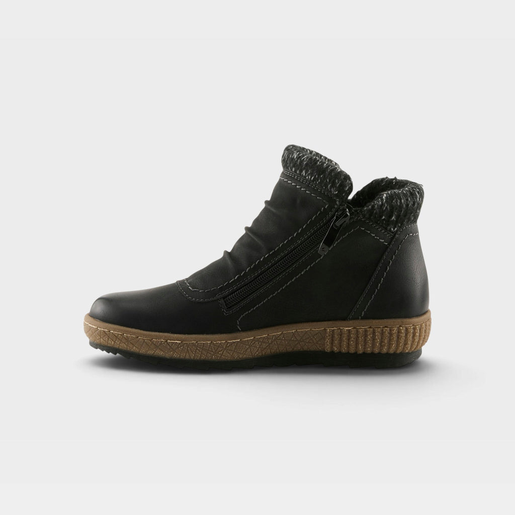 Women's ankle boot with side zipper, knit collar trim, and tan textured sole