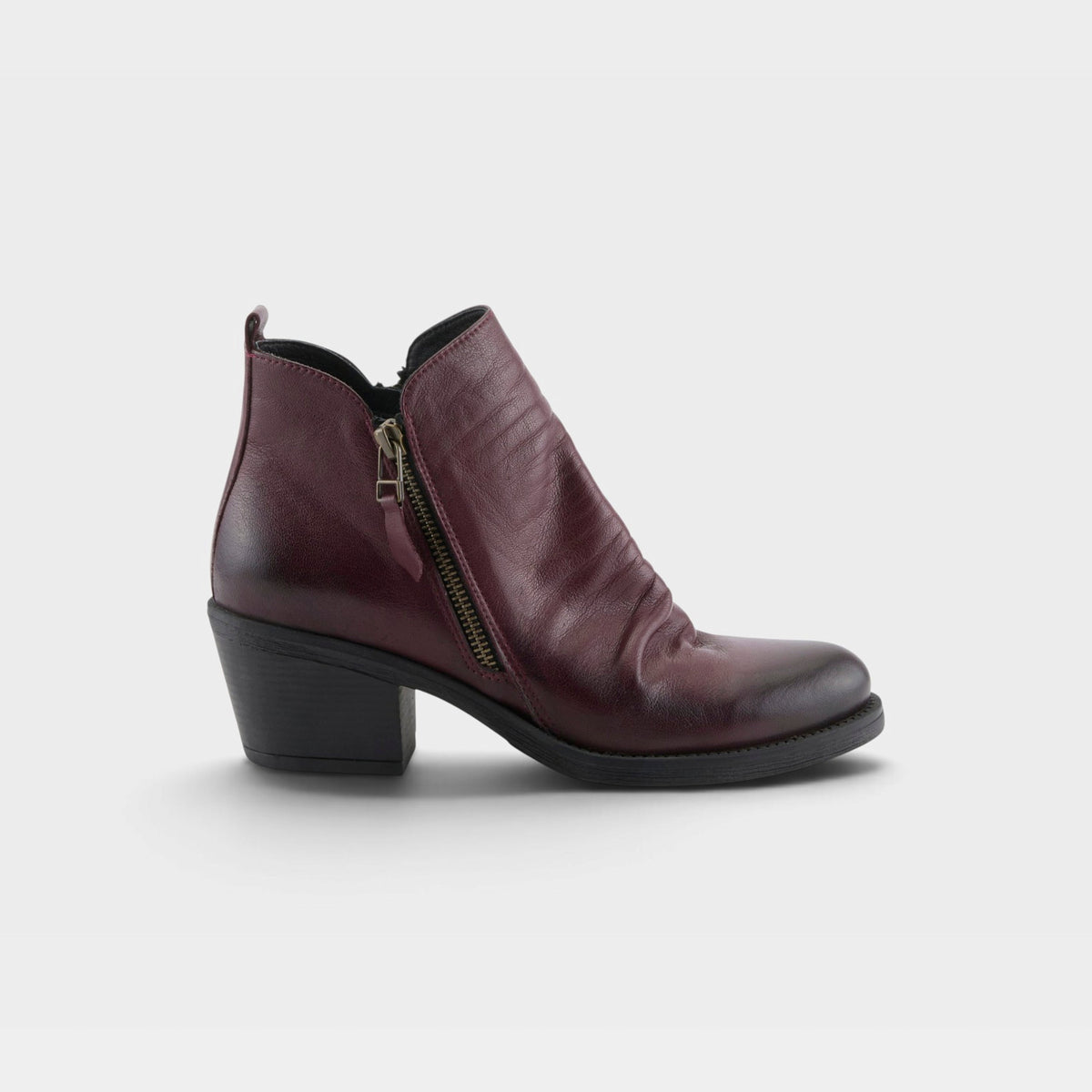 Women's leather ankle boot with side zipper, ruched detailing, and block heel