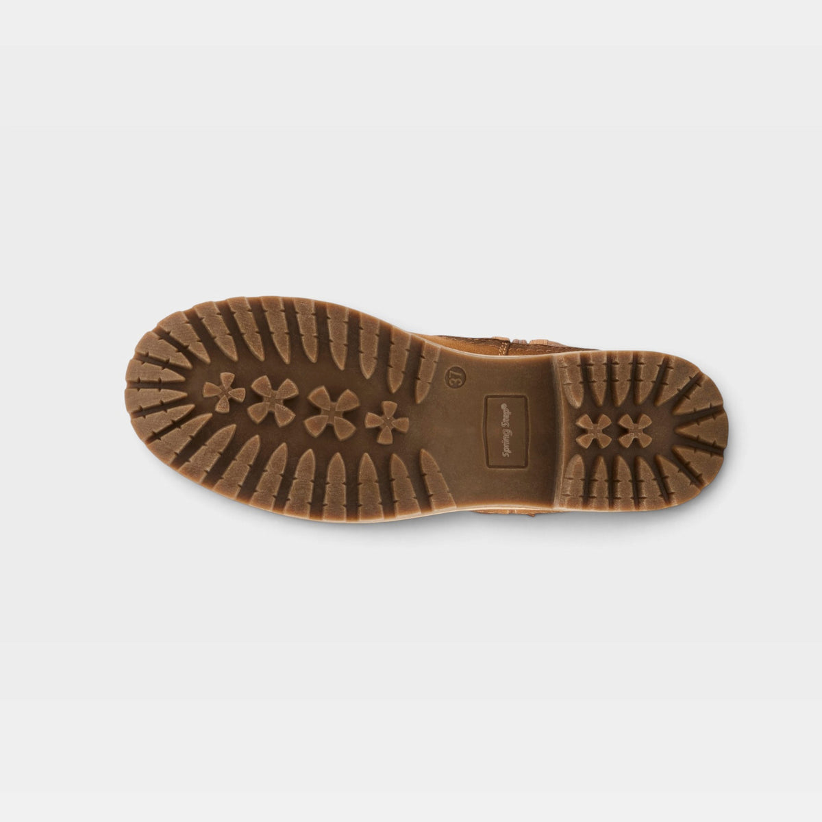 Bottom sole view of a women's boot showing lugged tread pattern with star motifs