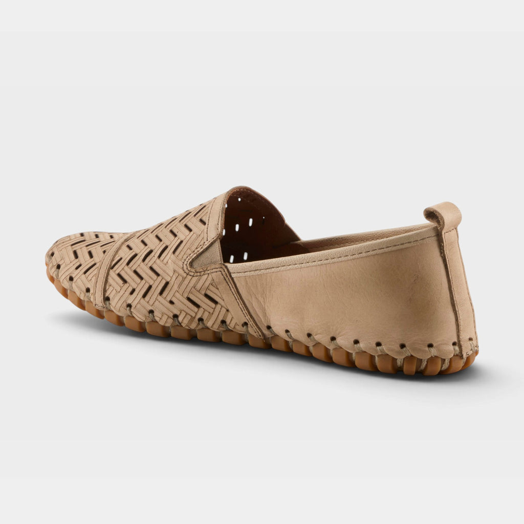 Back view of a beige woven leather slip-on flat with textured rubber sole and pull tab