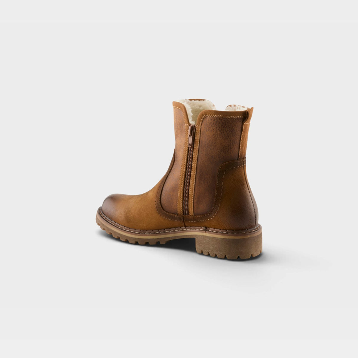 Rear view of a womens ankle boot with side zipper and shearling lining on lug sole