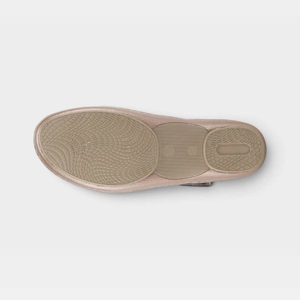 Bottom sole view of a womens clog shoe with textured rubber outsole and heel pad