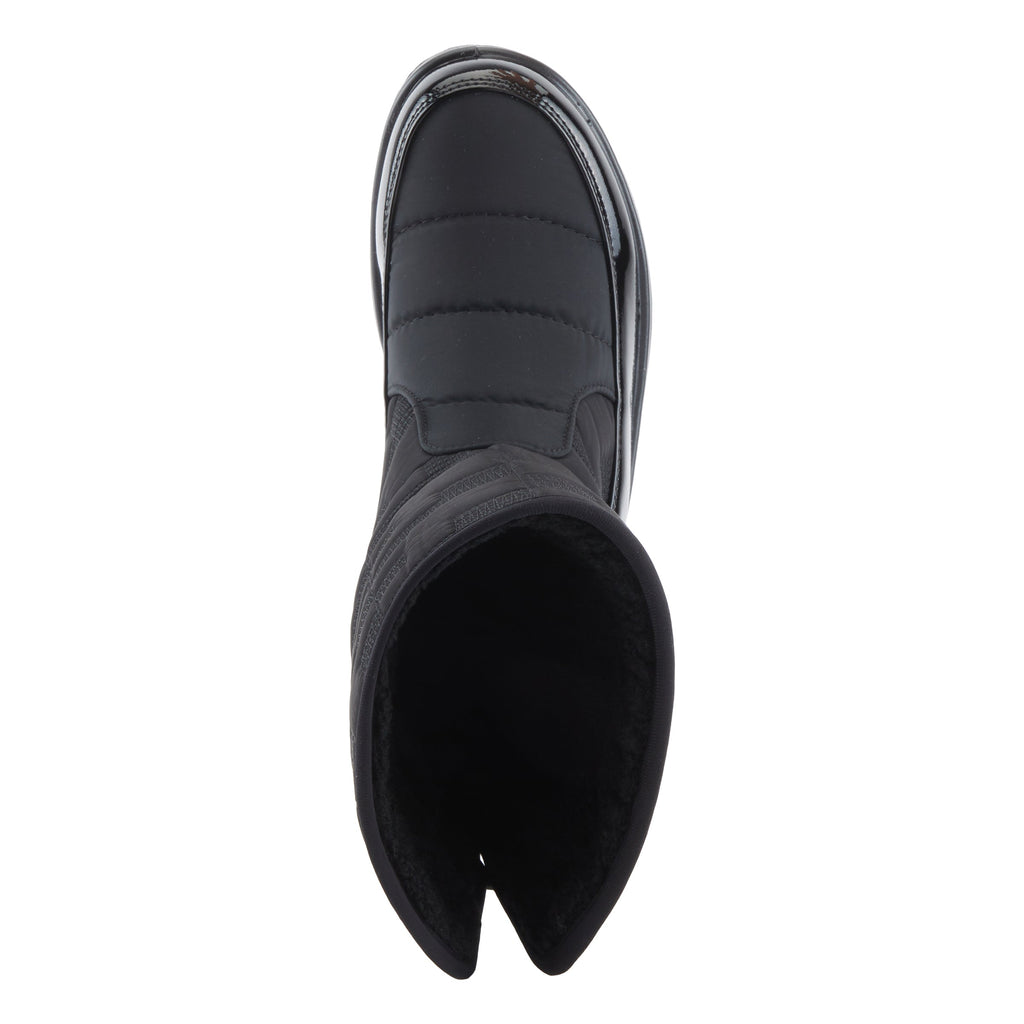 Top-down view of a black quilted winter boot with faux fur lining and rubber sole