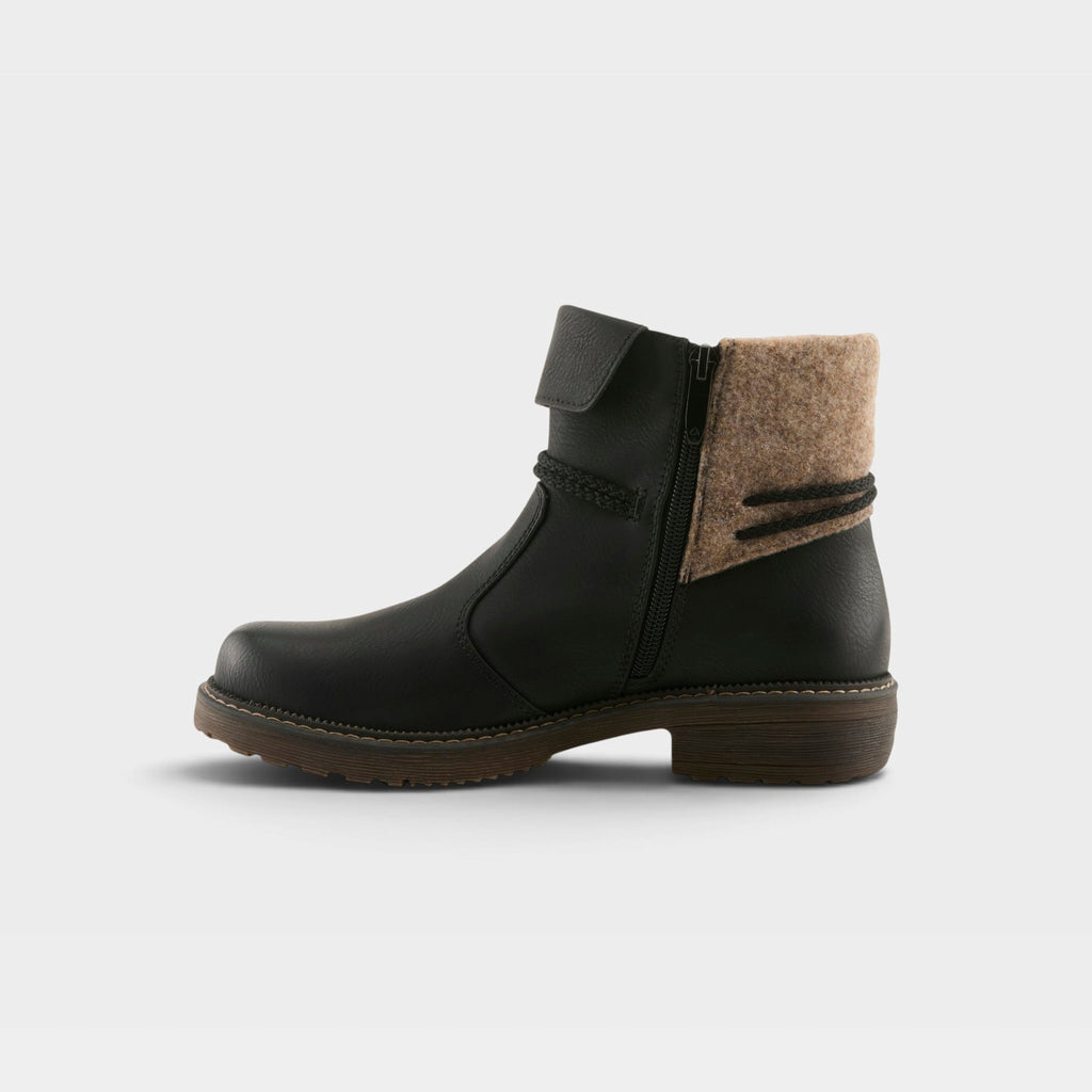Women's ankle boot with black leather upper, tan felt cuff, side zipper, and lug sole