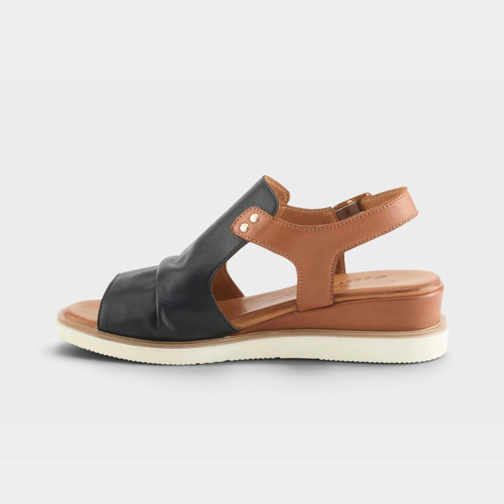 Spring Step Locals women's sandal with black toe strap and tan leather slingback on white sole