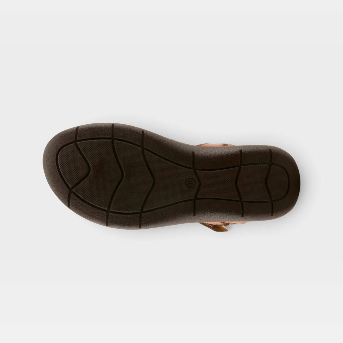 Bottom view of womens sandal showing dark brown rubber outsole with traction grooves