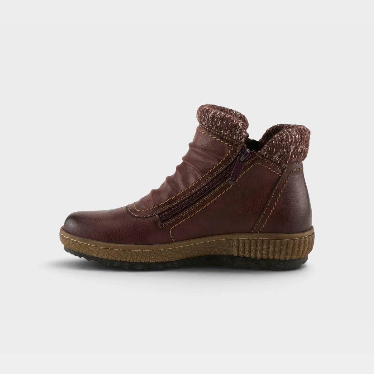 Women's ankle boot with knit collar, side zipper, ruched leather upper, and chunky sole