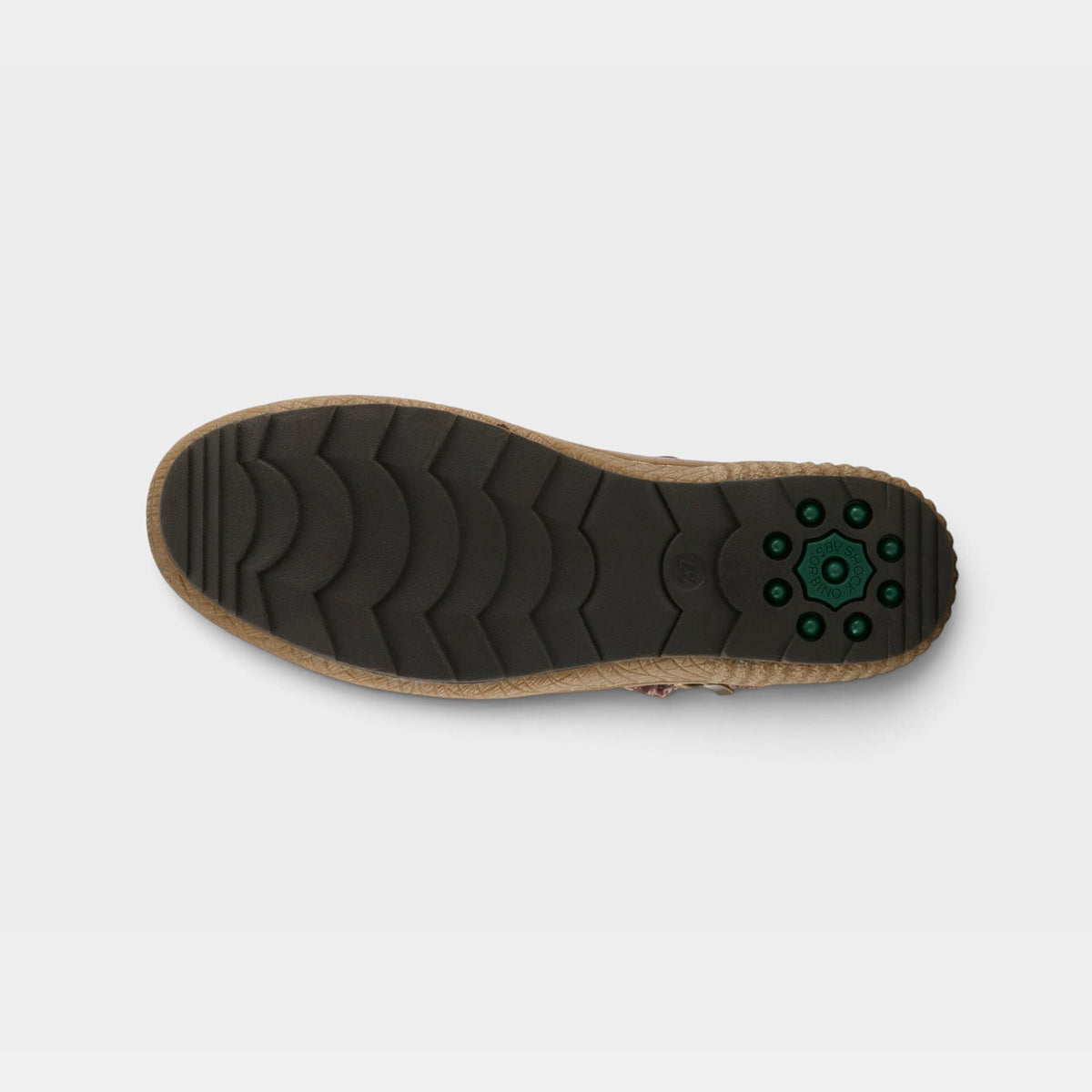 Bottom view of womens boot showing dark rubber lug sole with chevron tread pattern