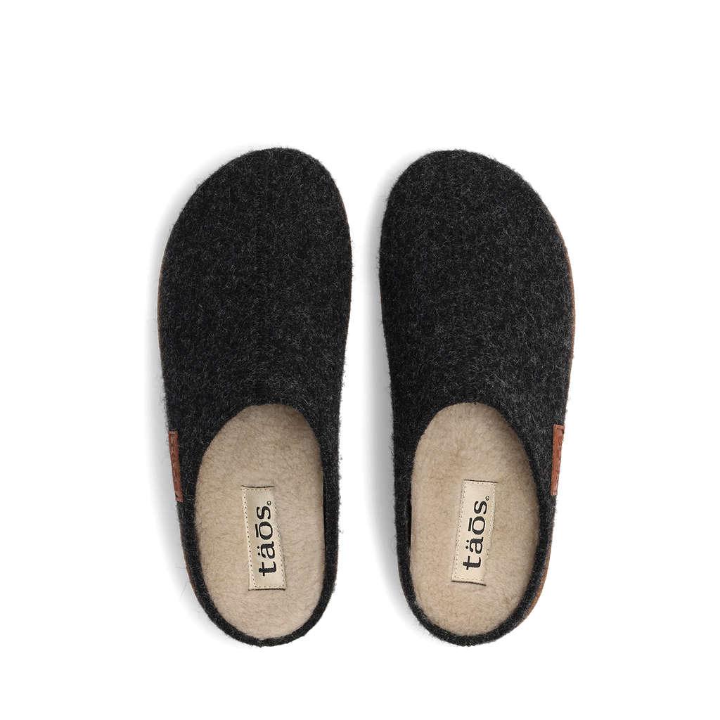 Taos Woolness slip-on slippers in dark charcoal felt with cream wool lining, top view