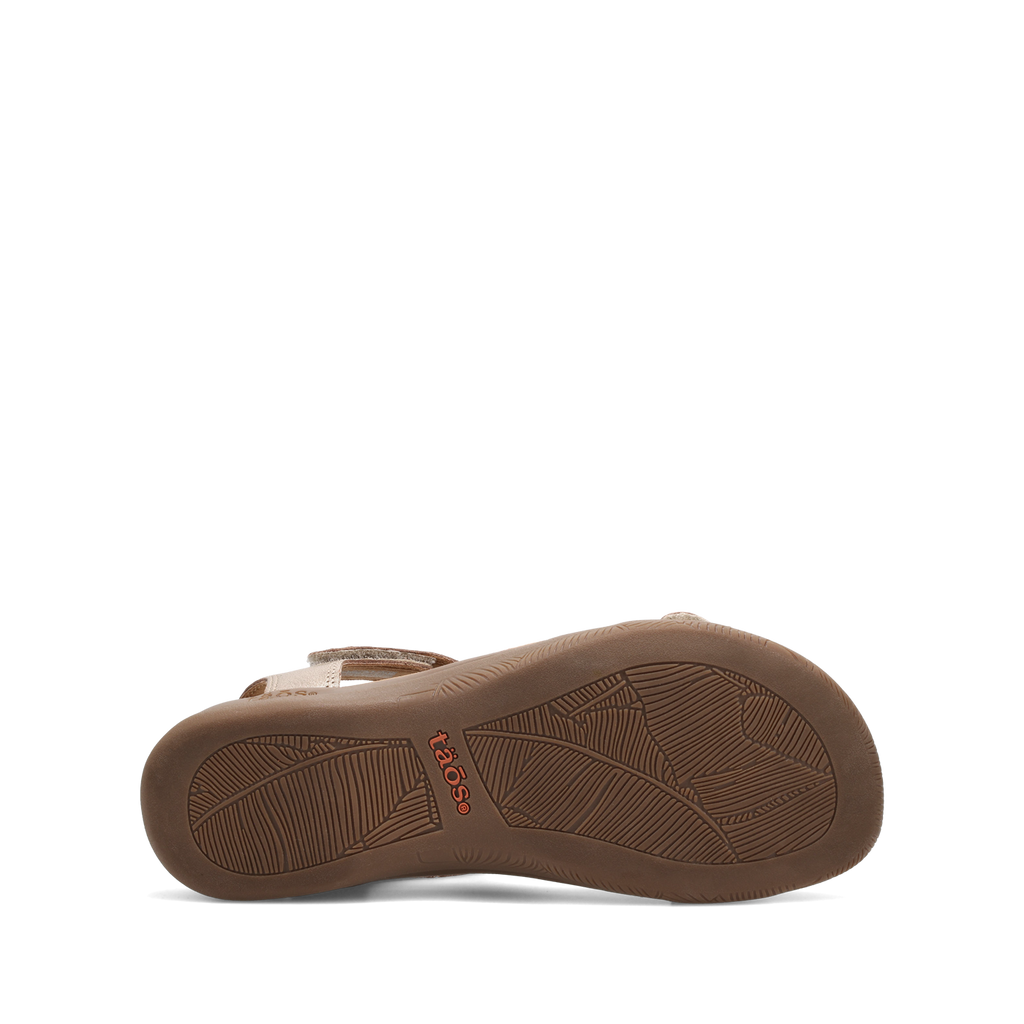 Bottom sole view of Taos women's sandal showing leaf-patterned rubber outsole with brand logo