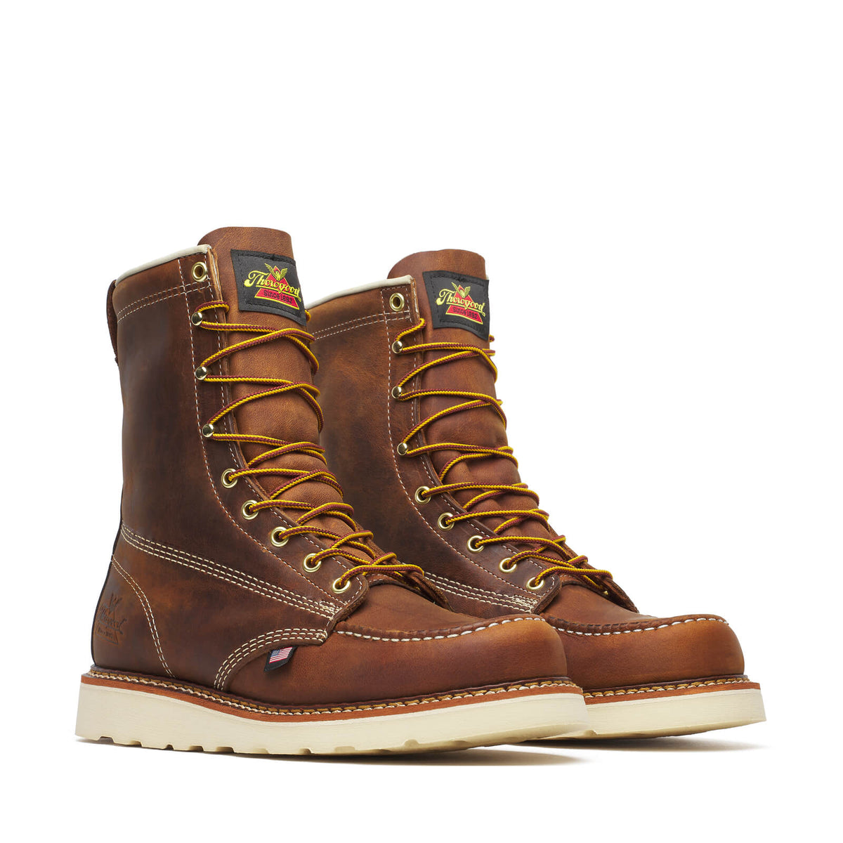 Thorogood men's moc toe wedge work boots with golden laces on white background