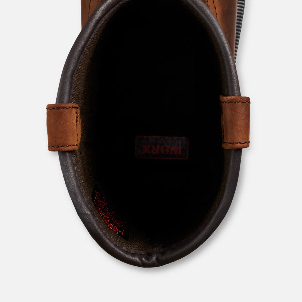 Top-down view inside pull-on work boot showing interior lining and pull tabs